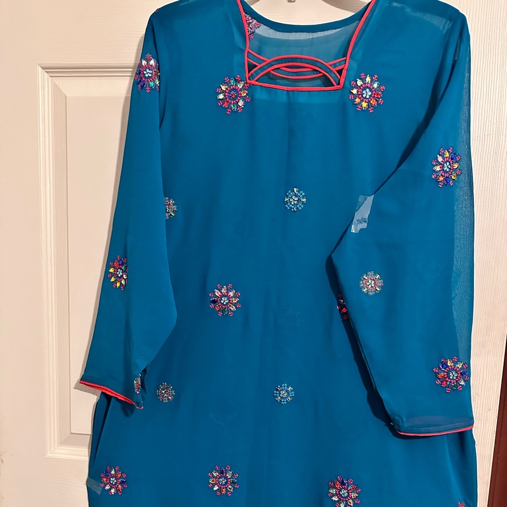 Stunning green colored Kameez and Salwar with  dupatta/scarf adorned with beads